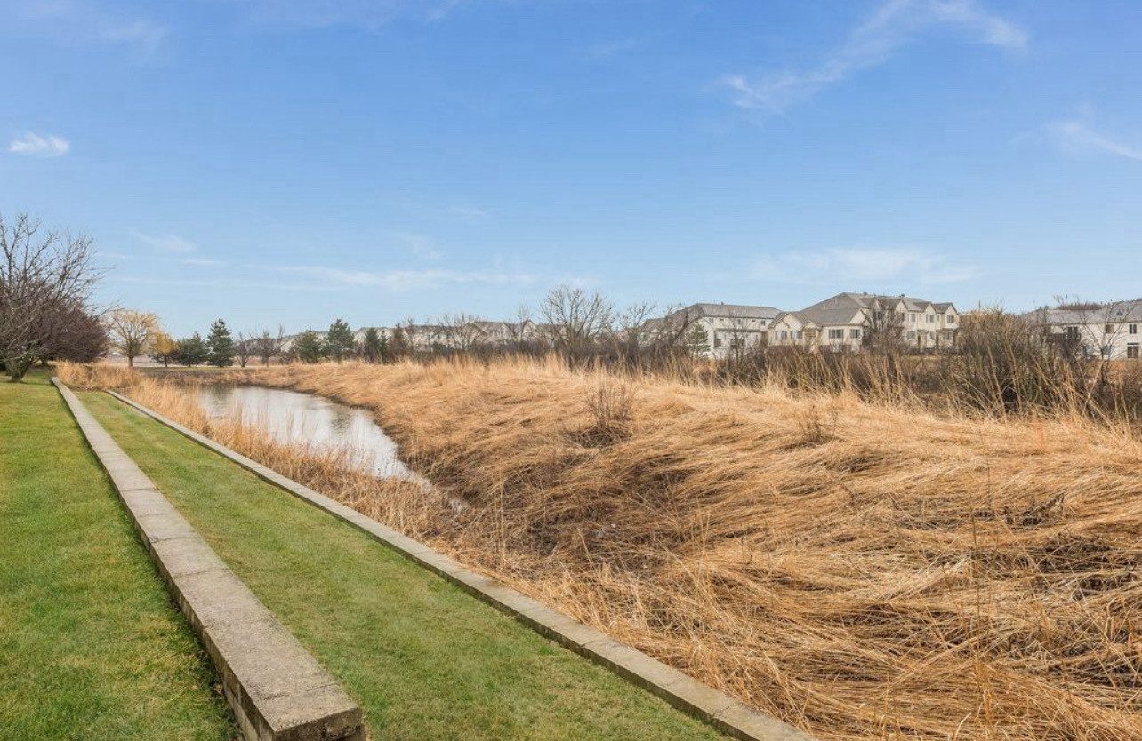 2305 Summerlin Drive Aurora, IL 60503 - Photo 22 of 22 a view of a lake with mountain in the background