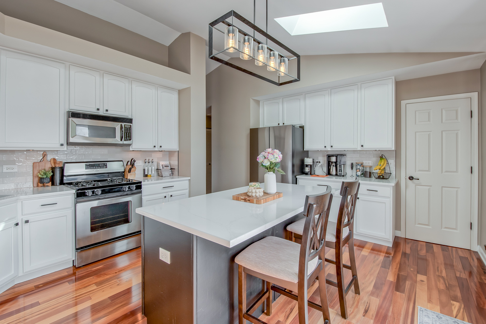 2305 Summerlin Drive Aurora, IL 60503 - Photo 10 of 22 a view of kitchen with sink and wooden floor