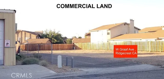 a view of a street with barn