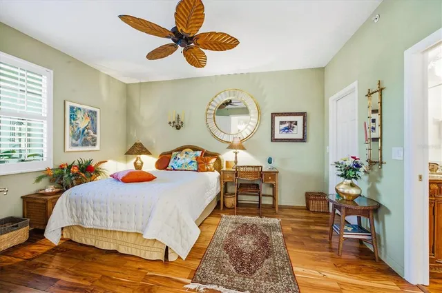 a bathroom with a sink a toilet a mirror and shower curtain