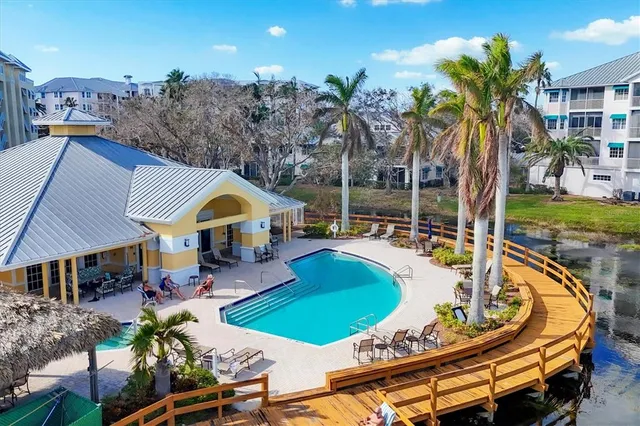 a swimming pool with outdoor seating and yard