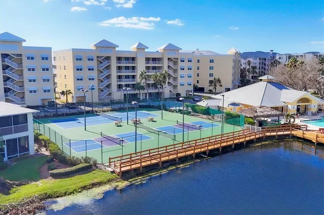 a view of swimming pool with a lounge chairs