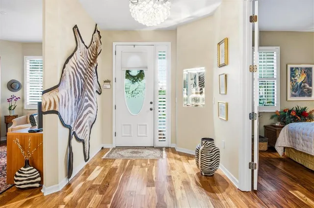 a bedroom with furniture and wooden floor