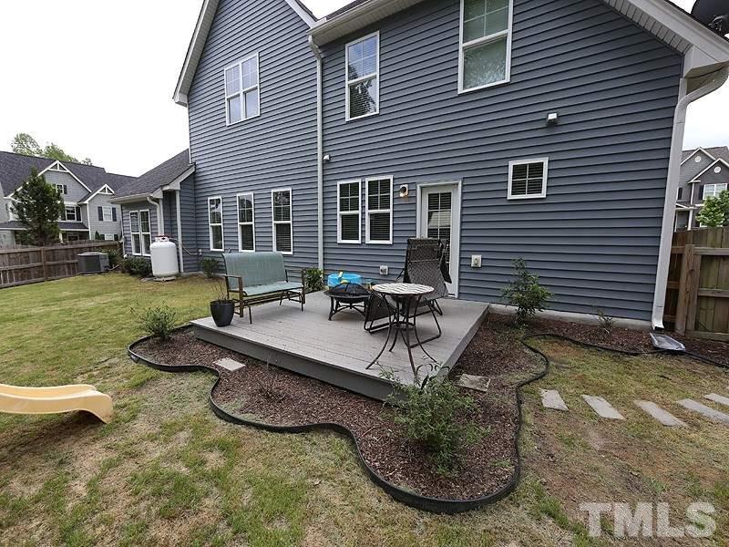 4437 Glengrove Road Raleigh, NC 27616 - Photo 22 of 24 a view of a house with backyard porch and sitting area