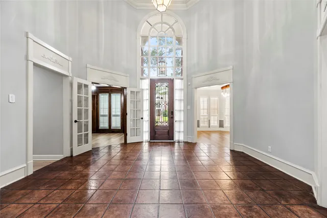 a view of an entryway with wooden floor