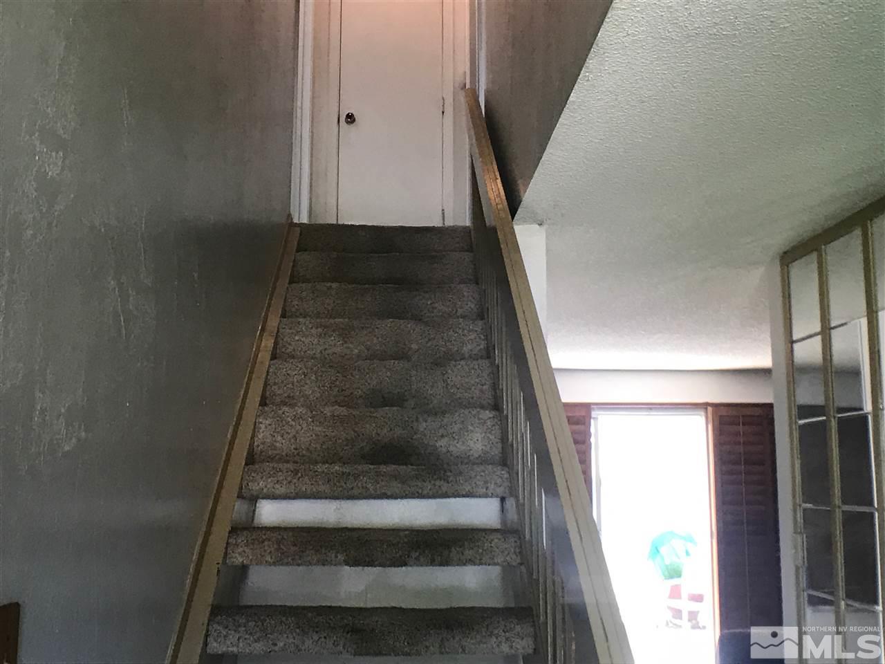 1230 Conway Lane Reno, NV 89503 - Photo 10 of 24 a view of staircase with white walls and windows