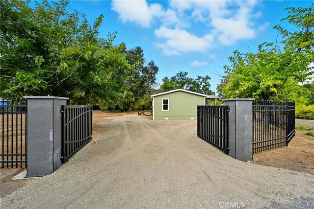 a view of a wooden fence and a street view