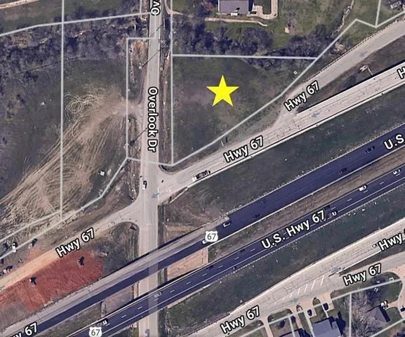 a close view of a faucet a rug and a potted plant in the front of a window