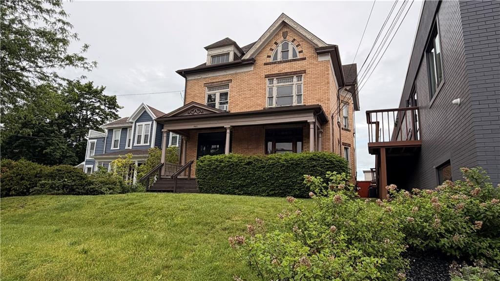 983 3rd Street Beaver, PA 15009 - Photo 2 of 14 a front view of a house with a garden
