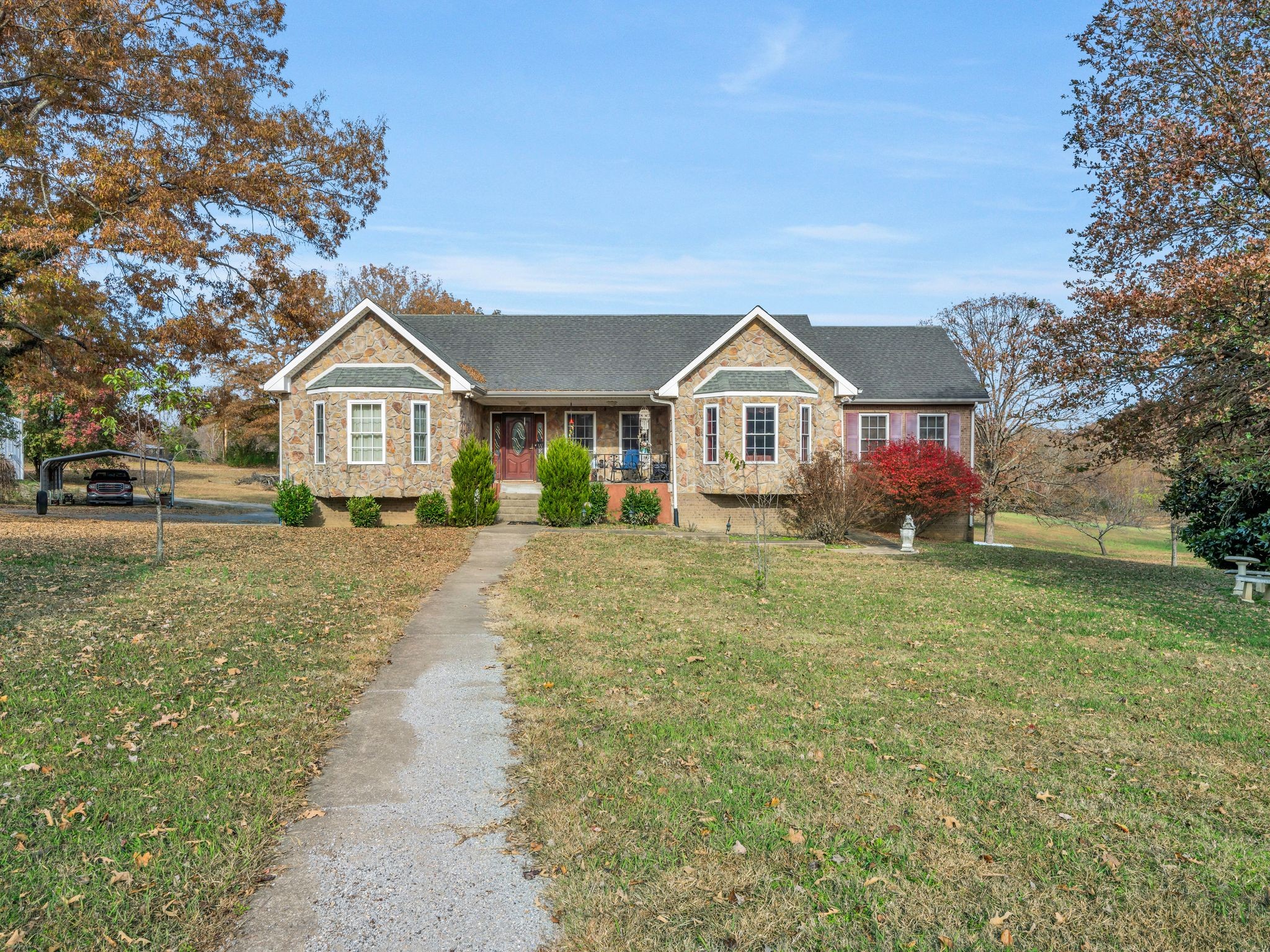 311 Downs Road Cumberland City, TN 37050 - Photo 3 of 30 a front view of a house with a yard