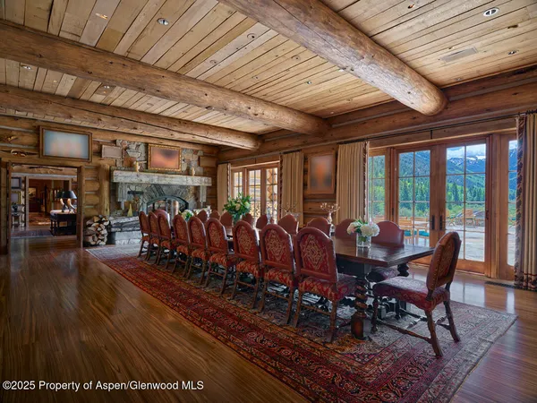 a living room with fireplace furniture and a flat screen tv