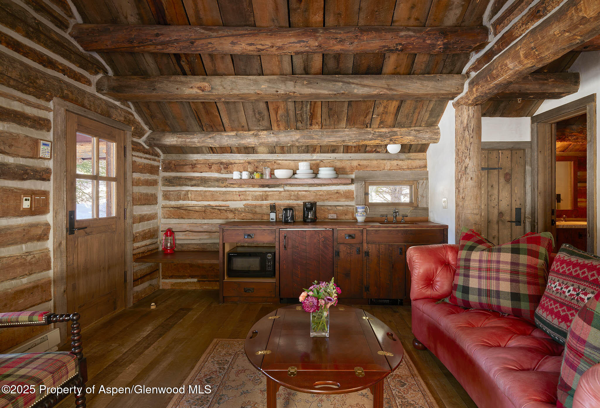 125 Rooney Circle Aspen, CO 81612 - Photo 42 of 56 a living room with furniture and a fireplace