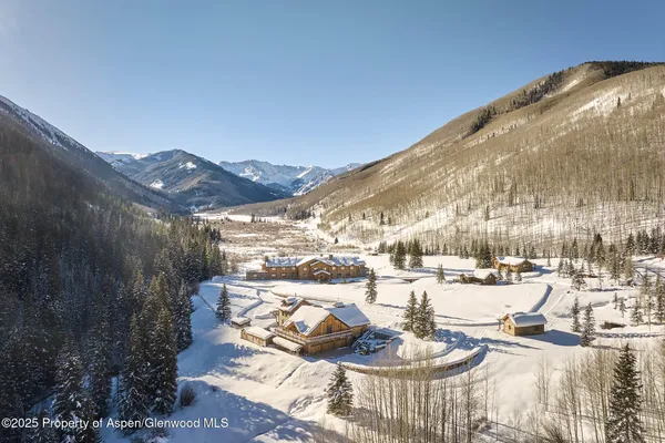 a view of a room with lots of wooden furniture