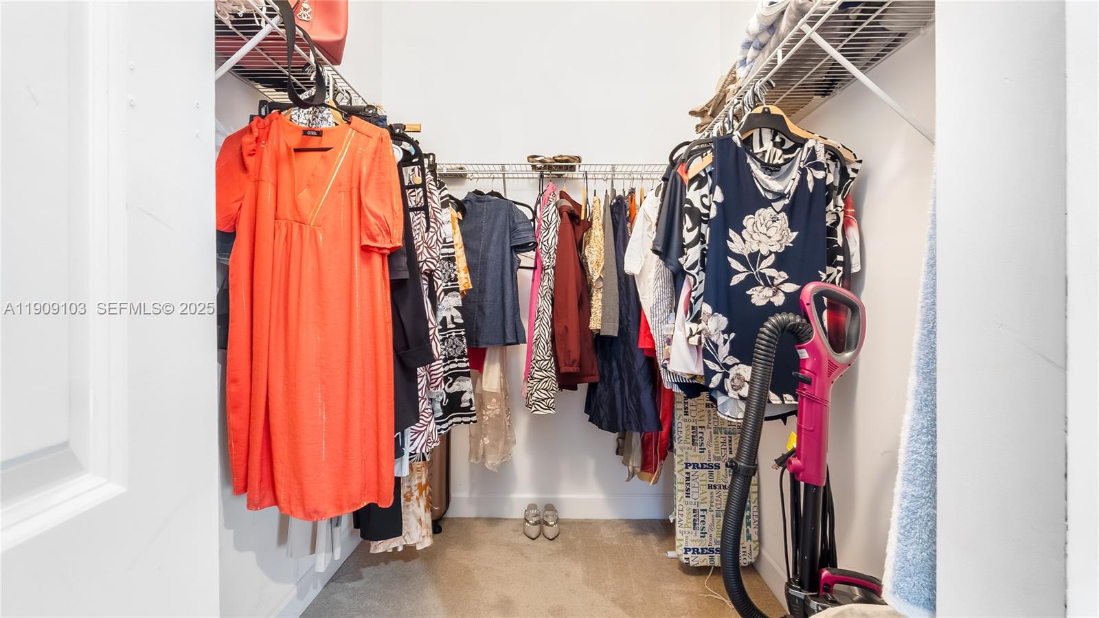 4445 Northwest 48th Terrace Tamarac, FL 33319 - Photo 13 of 19 a view of walk in closet with clothes