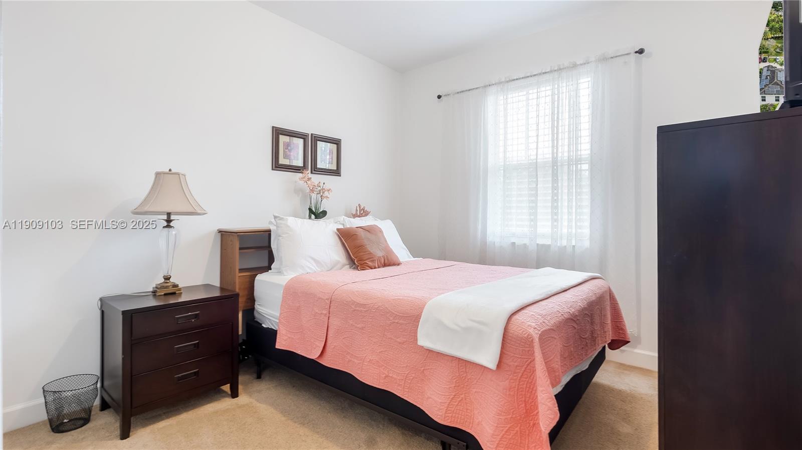 4445 Northwest 48th Terrace Tamarac, FL 33319 - Photo 14 of 19 a bedroom with a bed and a window