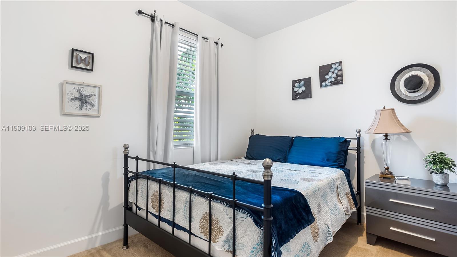 4445 Northwest 48th Terrace Tamarac, FL 33319 - Photo 15 of 19 a bedroom with a bed and a window