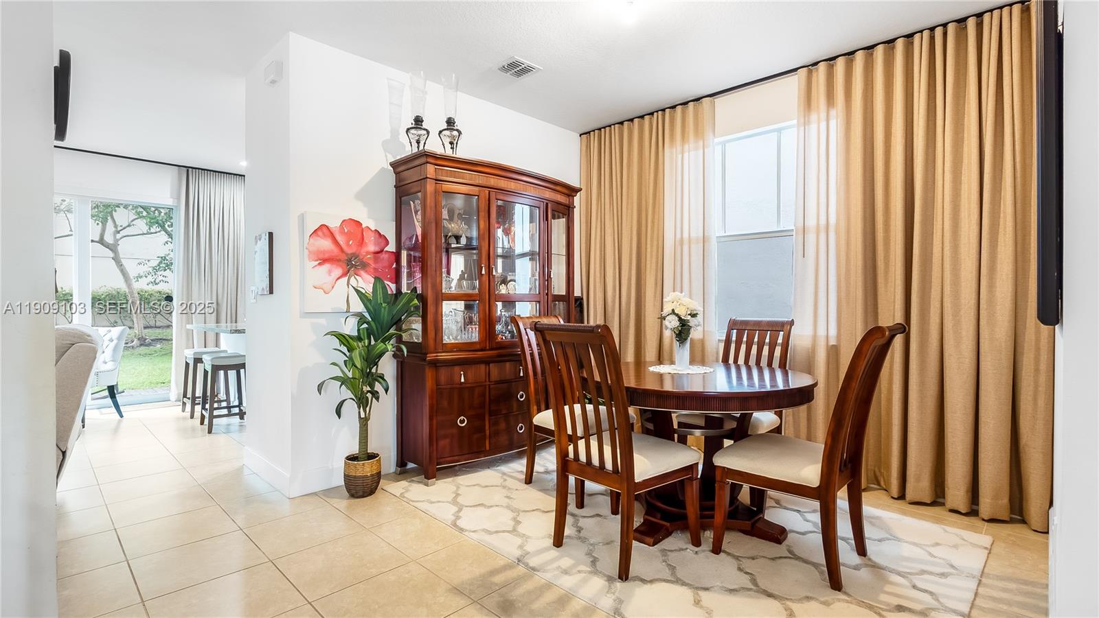 4445 Northwest 48th Terrace Tamarac, FL 33319 - Photo 6 of 19 a view of a dining room with furniture and a window