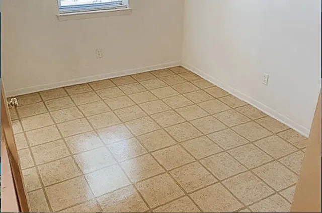 a view of a room and window