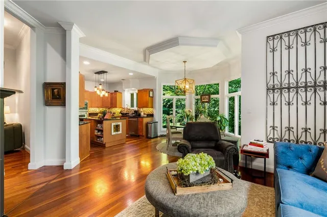 a bathroom with a granite countertop sink a toilet and mirror
