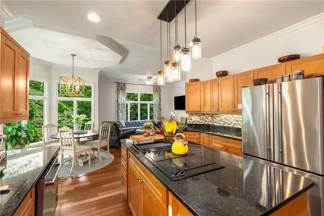 a balcony with furniture and garden view
