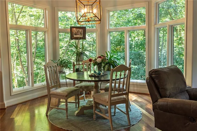 a view of a patio with table and chairs and potted plants
