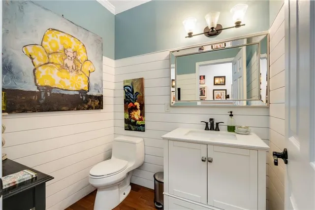 a room with lots of furniture and a potted plant