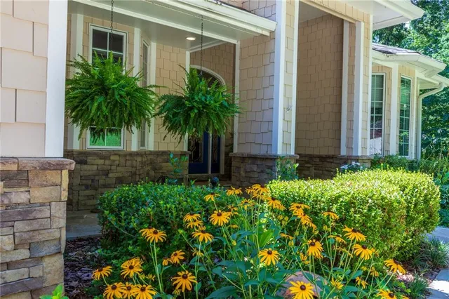 a front view of a house with garden