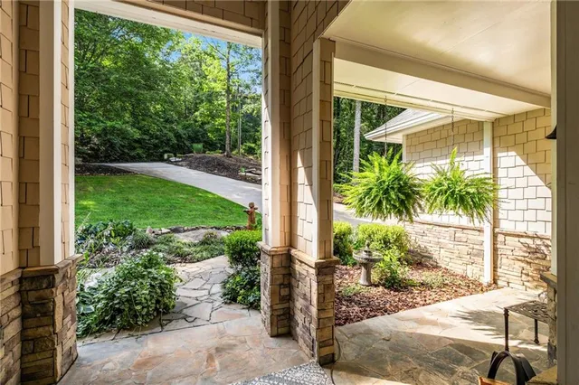a view of a backyard with a tree