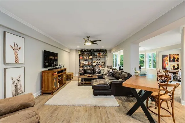 an aerial view of residential houses with outdoor space and trees
