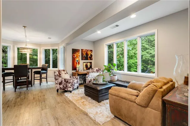 a view of a patio with table and chairs next to a yard