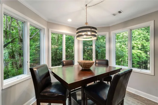 a front view of house with a garden