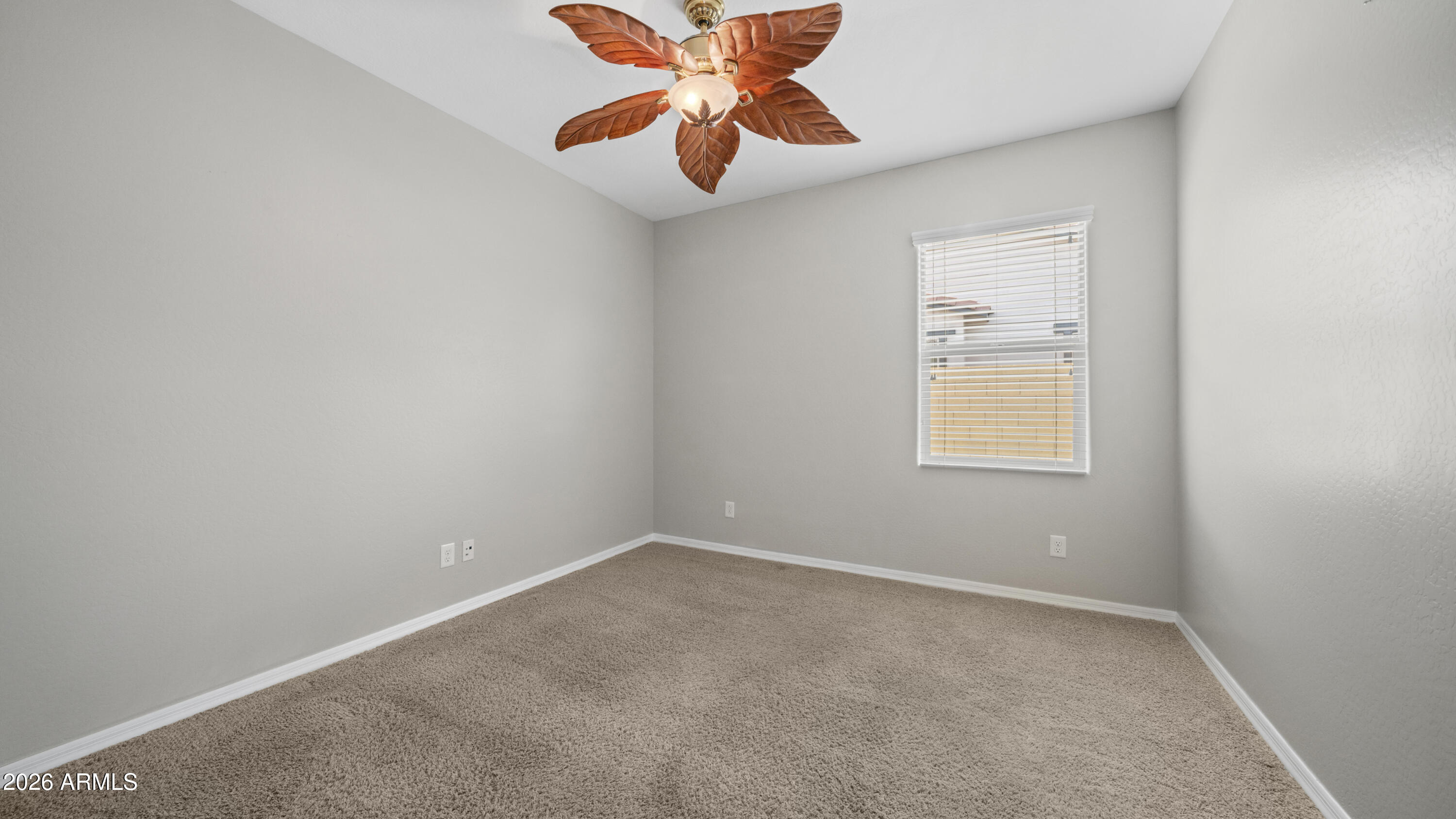 16159 West Granada Road Goodyear, AZ 85395 - Photo 30 of 41 an empty room with closet and window