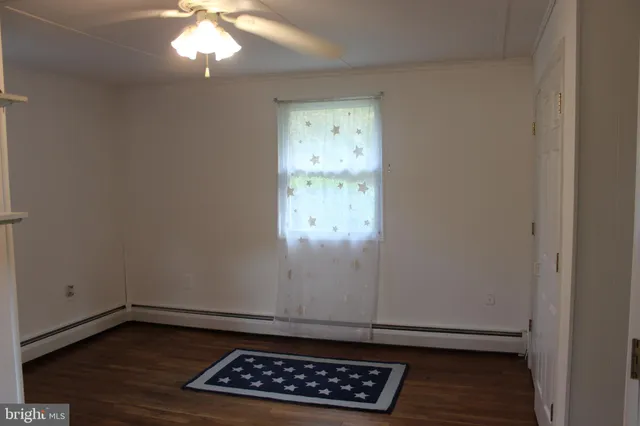 a kitchen with a table and chairs in it