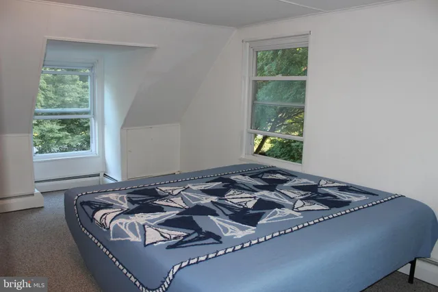 a bedroom with a bed and lamp