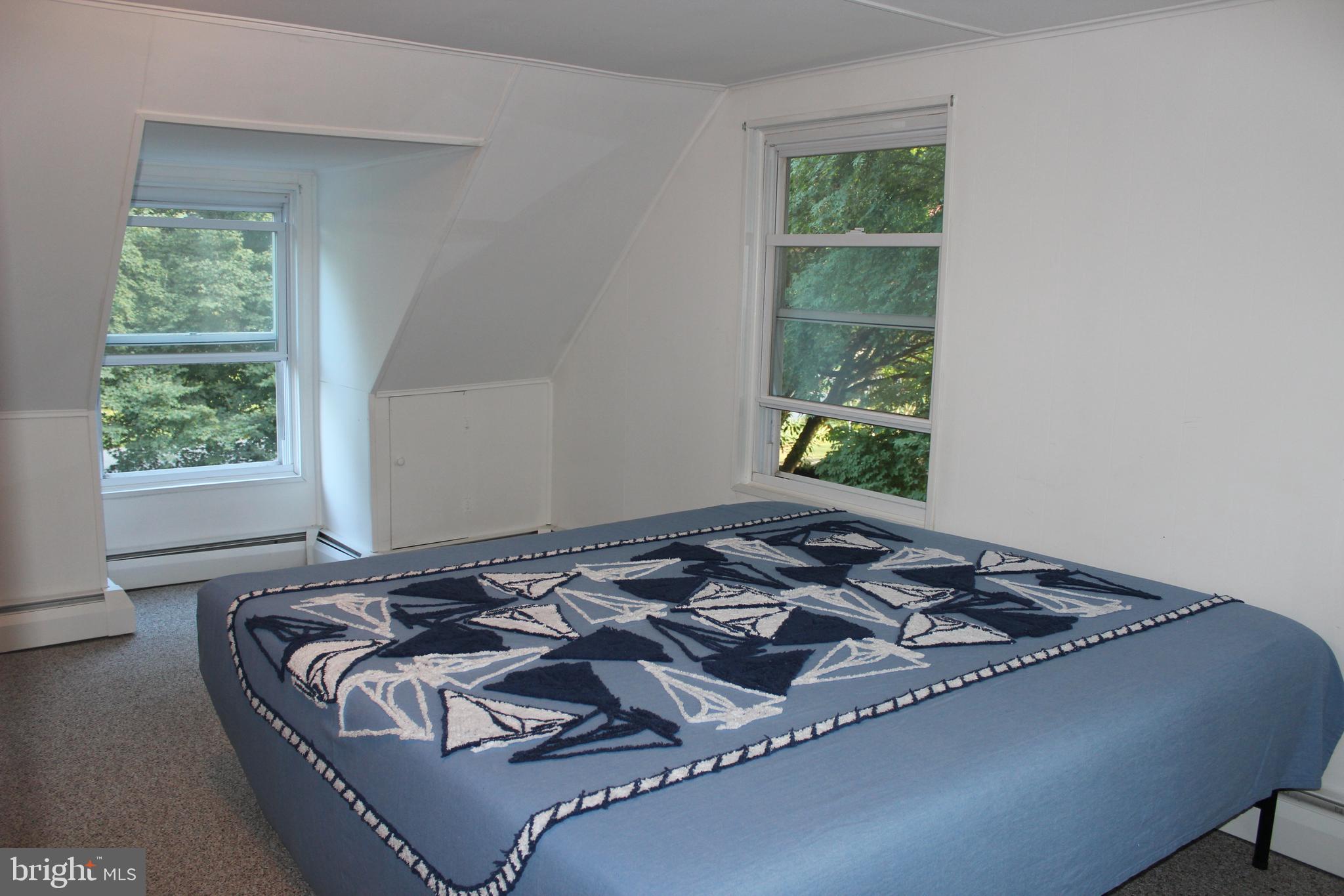 73 Drift Way Earleville, MD 21919 - Photo 13 of 33 a bed sitting in a bedroom next to a window