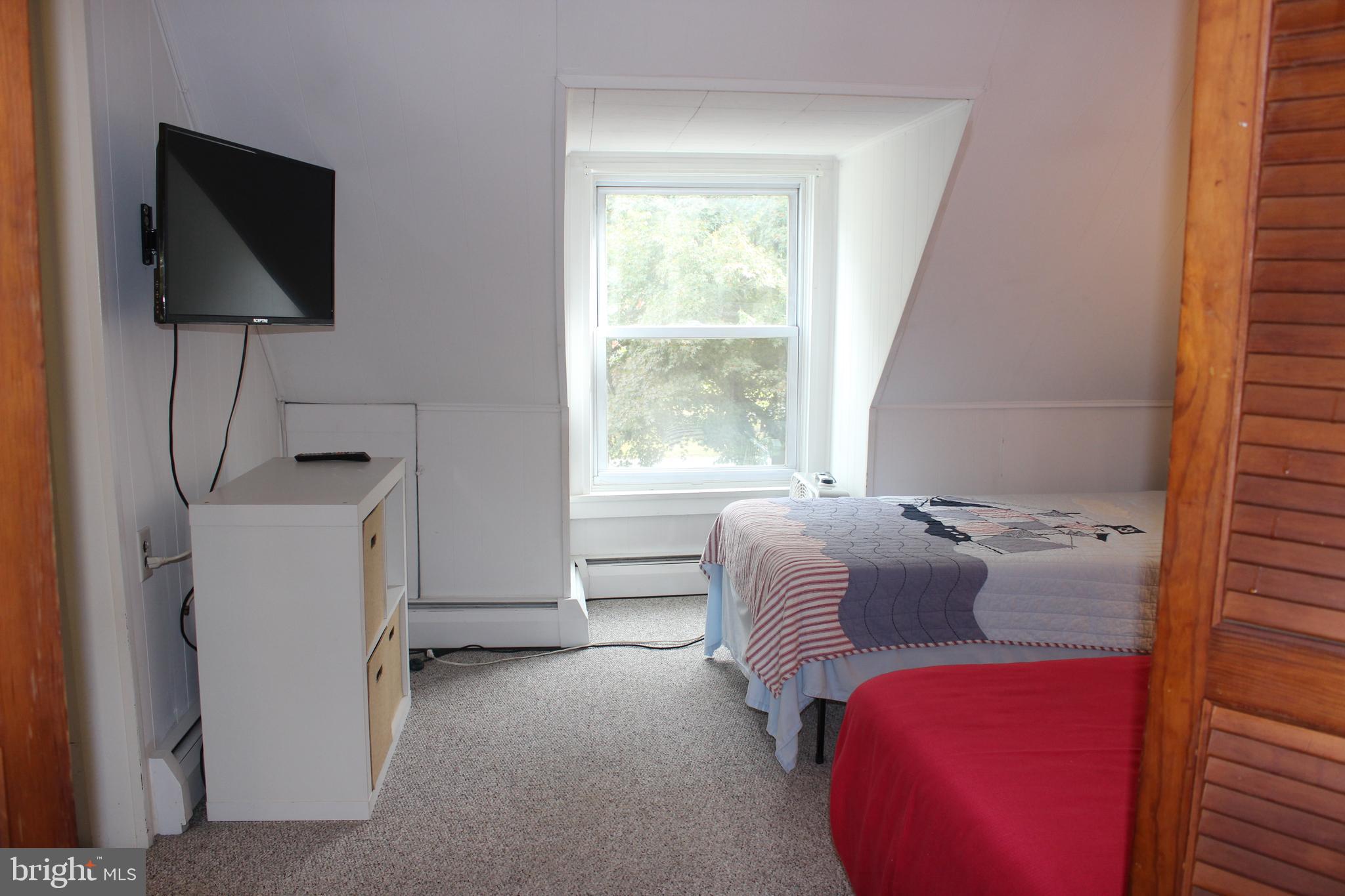 73 Drift Way Earleville, MD 21919 - Photo 16 of 33 a bedroom with a bed and a flat screen tv
