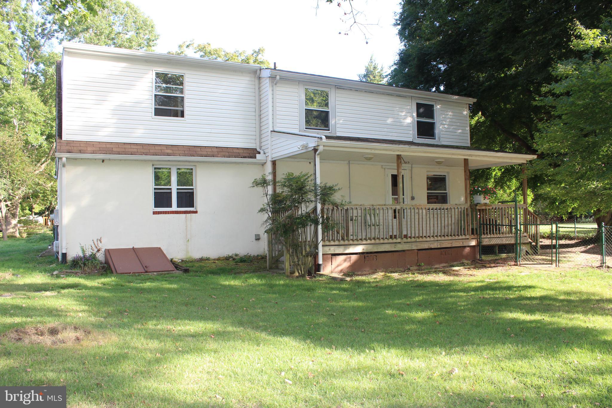 73 Drift Way Earleville, MD 21919 - Photo 5 of 33 a view of a white house with a big yard and a large tree