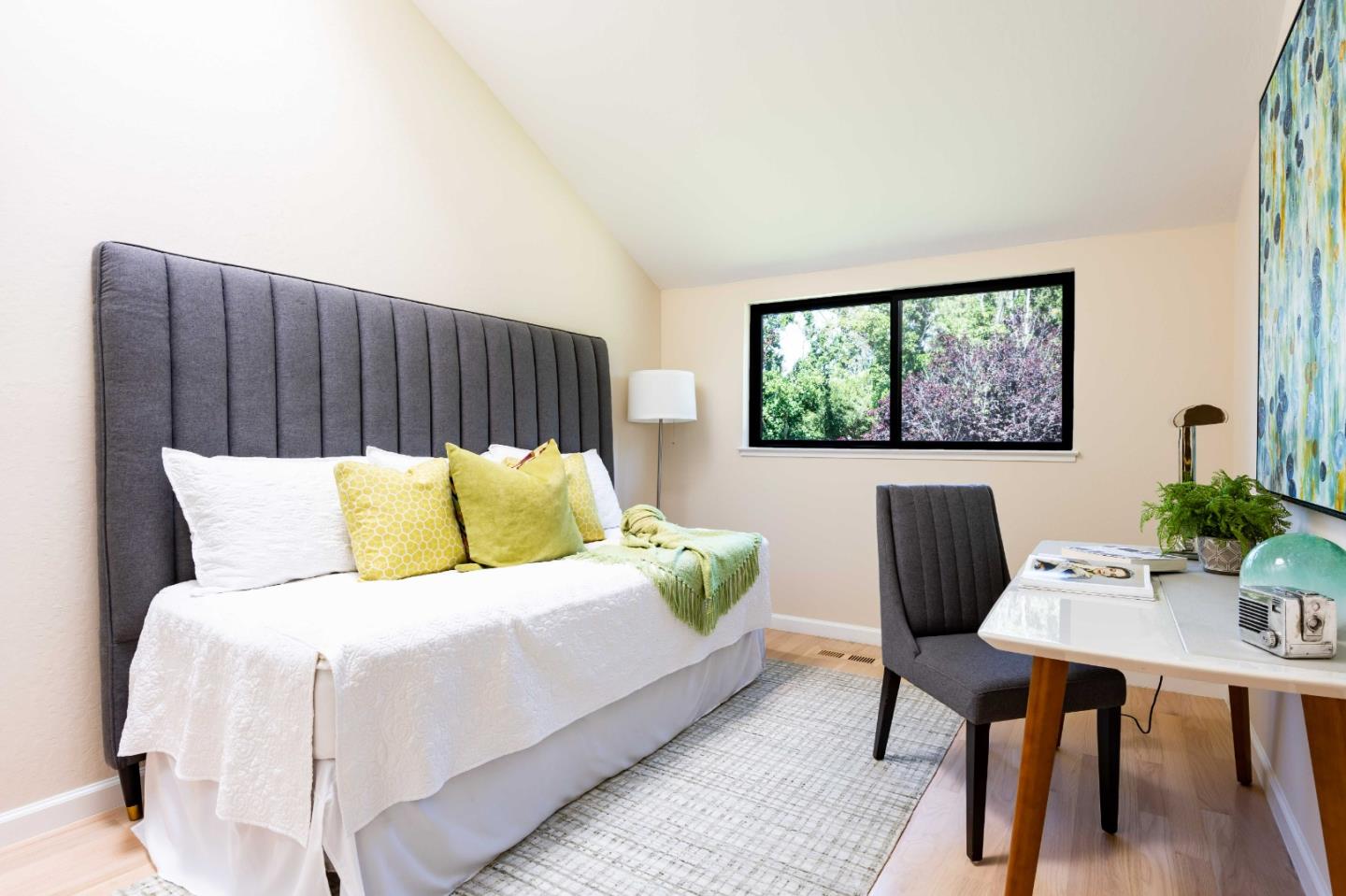 1655 Grant Road Mountain View, CA 94040 - Photo 12 of 24 a bedroom with a bed and a table in it