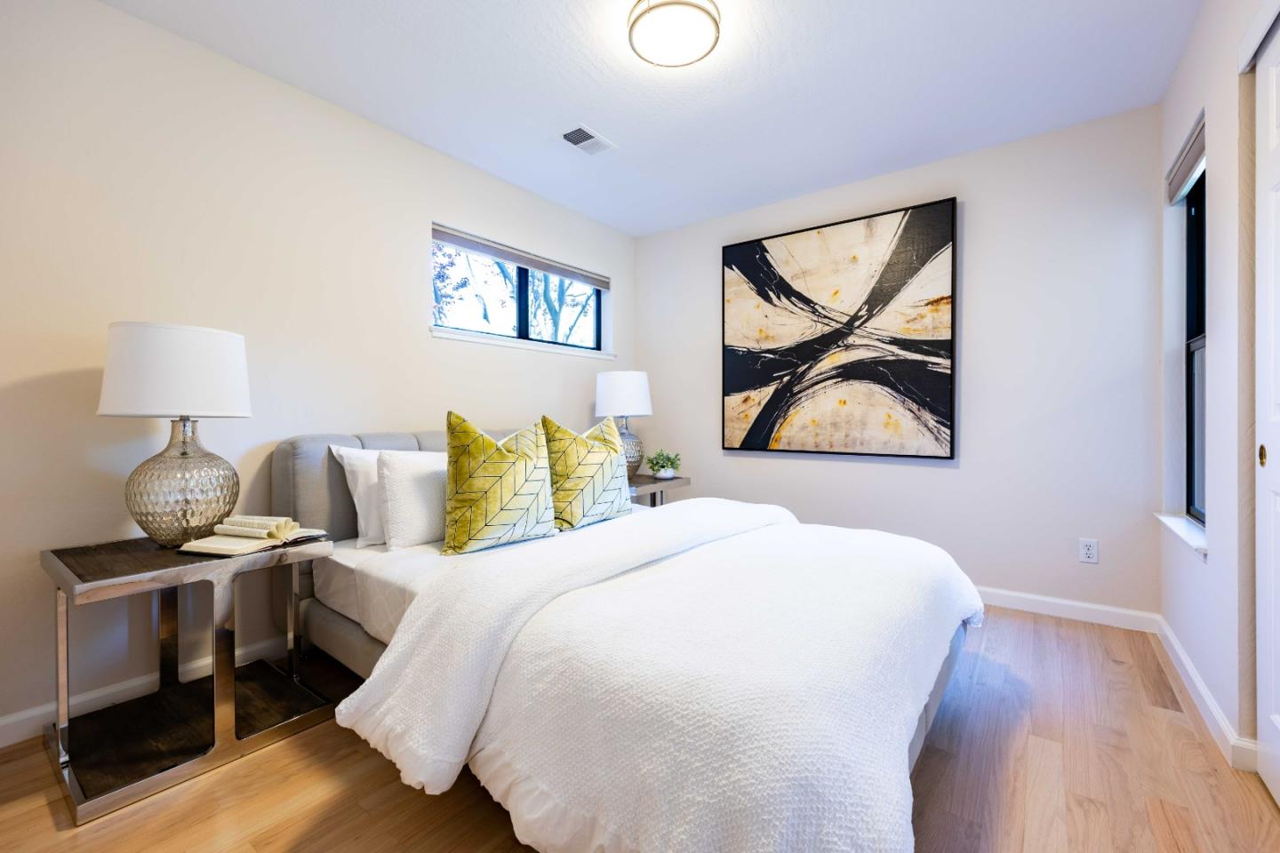 1655 Grant Road Mountain View, CA 94040 - Photo 15 of 24 a bedroom with a bed and wooden floor