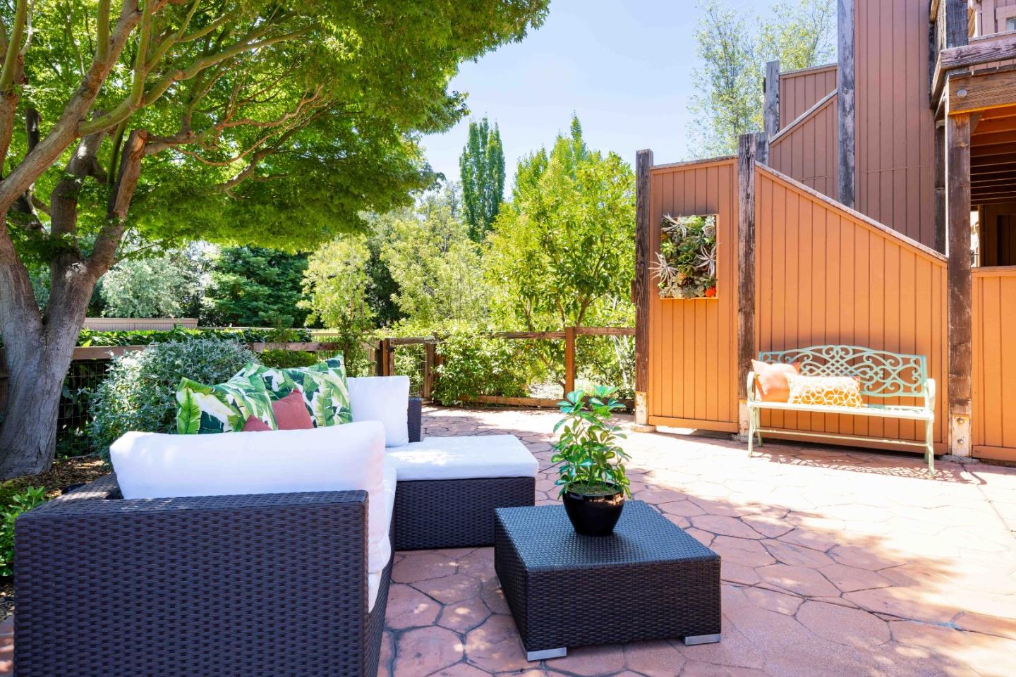 1655 Grant Road Mountain View, CA 94040 - Photo 20 of 24 a view of a patio with couches table and chairs and potted plants