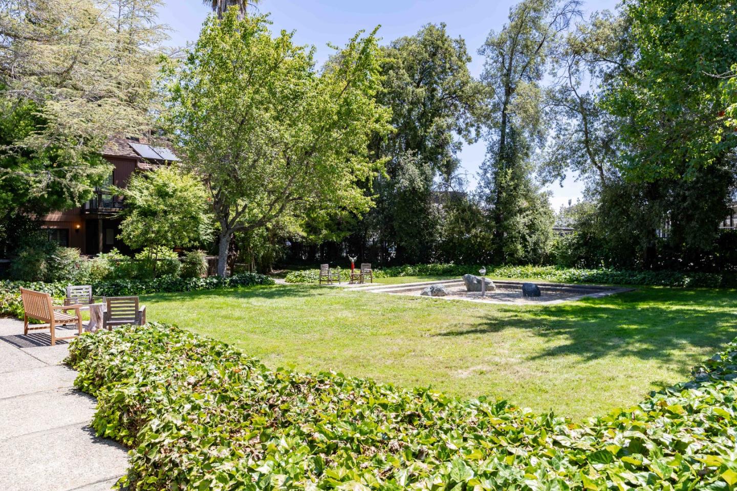 1655 Grant Road Mountain View, CA 94040 - Photo 22 of 24 a view of swimming pool with lawn chairs and large trees