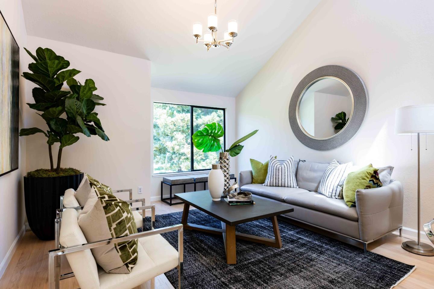 1655 Grant Road Mountain View, CA 94040 - Photo 9 of 24 a living room with furniture a window and a potted plant