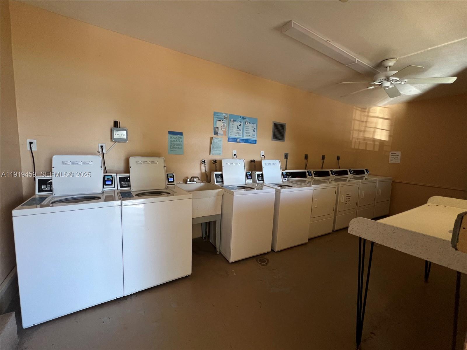 301 Cambridge Road, Unit 211 Hollywood, FL 33024 - Photo 12 of 33 a kitchen with cabinets a sink and appliances