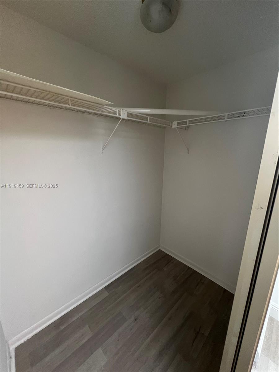 301 Cambridge Road, Unit 211 Hollywood, FL 33024 - Photo 24 of 33 a view of a room with wooden floor