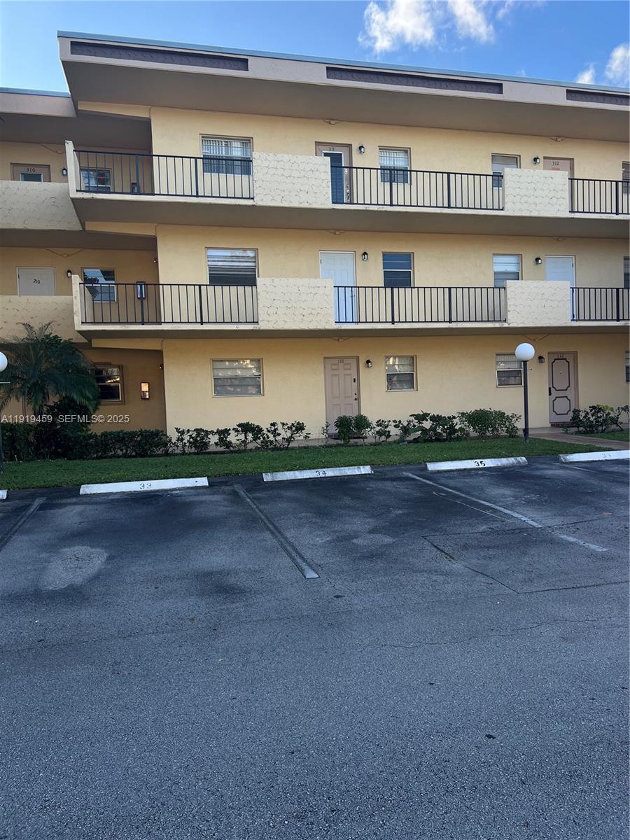 301 Cambridge Road, Unit 211 Hollywood, FL 33024 - Photo 8 of 33 a view of a street with a building in the background