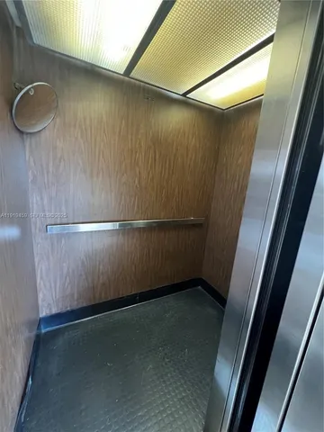 a view of a livingroom with an empty space and wooden floor