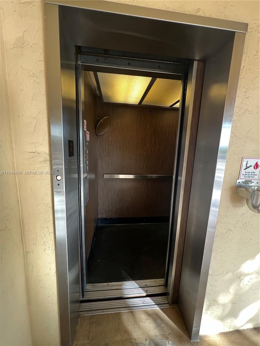 301 Cambridge Road, Unit 211 Hollywood, FL 33024 - Photo 10 of 33 a bathroom with a glass door