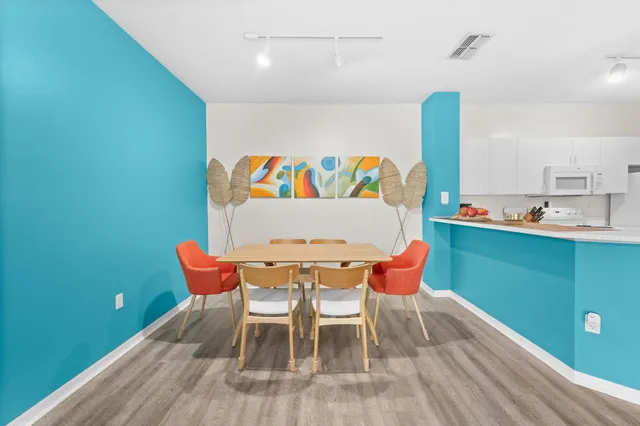 a outdoor room with a table and chairs