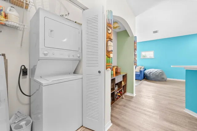 a en suite bathroom with a granite countertop sink and a mirror