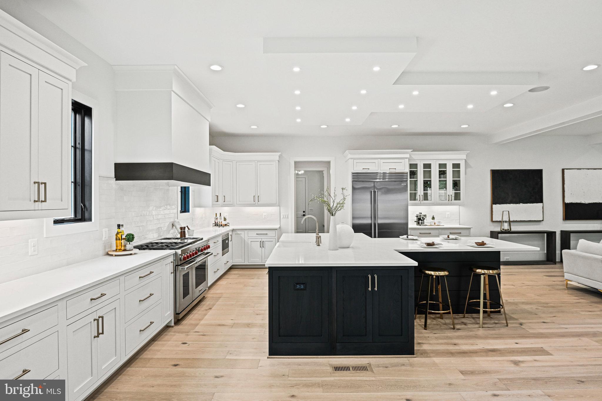 1109 Ingleside Avenue McLean, VA 22101 - Photo 12 of 94 a large kitchen with a large counter top a sink stainless steel appliances and cabinets